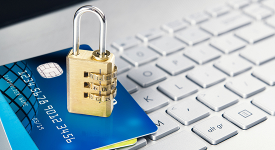 image of number lock on pile of credit cards on top of computer keyboard